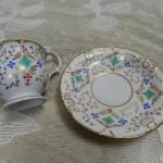 Zlacený hrnek s podšálkem - K.C. PRAG Zlacený hrnek s podšálkem - K.C. PRAG