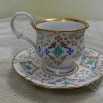 Zlacený hrnek s podšálkem - K.C. PRAG Zlacený hrnek s podšálkem - K.C. PRAG