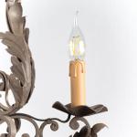 Zrestaurovaný kovový lustr Zrestaurovaný kovový lustr