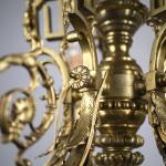 Starožitný bronzový lustr s berany