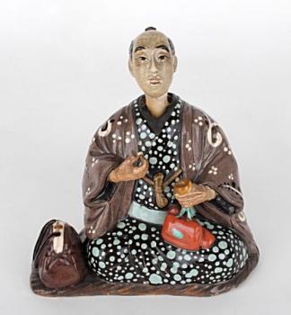 Japonská soška s kývající hlavou