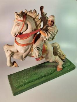 Dřevěná socha bojovníka na koni